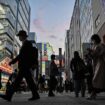 People walk outside a train station in the Akihabara district of Tokyo on May 9, 2024. (Photo by Richard A. Brooks / AFP)