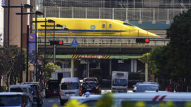 Shinkansen high-speed test trains or known as Doctor Yellow, travels along an overpass in the middle of downtown Monday, Feb. 6, 2023, in Tokyo. The special trains primarily monitor the high-speed rail network's condition. (AP Photo/Eugene Hoshiko)