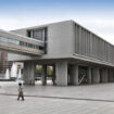Hiroshima, Japan - April 21, 2012: People walk past famous Peace Memorial Museum on April 21, 2012 in Hiroshima, Japan. It educates people about the infamous atomic bombing.