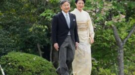 Japan's Emperor Naruhito (L) and Empress Masako arrive to greet guests at a spring garden party at the Akasaka Garden imperial garden in Tokyo on April 22, 2025. (Photo by Shuji Kajiyama / POOL / AFP)