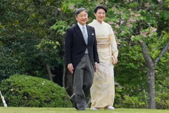 
					Japan's Emperor Naruhito (L) and Empress Masako arrive to greet guests at a spring garden party at the Akasaka Garden imperial garden in Tokyo on April 22, 2025. (Photo by Shuji Kajiyama / POOL / AFP)