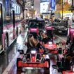 A group of tourists ride on 