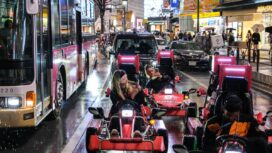 A group of tourists ride on 