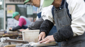 Retirees sharpen knives as part of the Silver Jinzai Service in Tokyo, Japan on Dec. 15 2015. The service, which aims to provide light work for the elderly, first came into into existence in 1975. Photographer: Rob Gilhooly