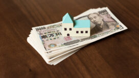 House and ten thousands yen bills.