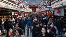 People walk along the main shopping street at Sensoji Temple in the popular tourist destination of Asakusa in central Tokyo on February 21, 2025. Japanese inflation accelerated in January, further pressuring households as prices excluding fresh food rose 3.2 percent on-year, government data showed on February 21. Overall, inflation including volatile fresh food was up 4.0 percent on-year -- among the highest in the G7 -- speeding up from 3.6 percent in December and 2.9 percent in November. (Photo by Richard A. Brooks / AFP)