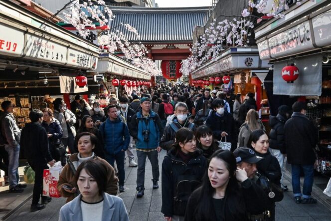 
					People walk along the main shopping street at Sensoji Temple in the popular tourist destination of Asakusa in central Tokyo on February 21, 2025. Japanese inflation accelerated in January, further pressuring households as prices excluding fresh food rose 3.2 percent on-year, government data showed on February 21. Overall, inflation including volatile fresh food was up 4.0 percent on-year -- among the highest in the G7 -- speeding up from 3.6 percent in December and 2.9 percent in November. (Photo by Richard A. Brooks / AFP)