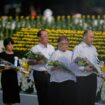 Visitors offer flowers to Hiroshima Memorial Cenotaph during the ceremony to mark the 80th anniversary of the bombing at the Hiroshima Peace Memorial Park in Hiroshima, western Japan, Wednesday, Aug. 6, 2025. (AP Photo/Louise Delmotte)