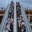 People ride one of the outdoor escalators as they visit the 2025 Osaka Expo in the city of Osaka on May 21, 2025. The number of foreign visitors to Japan soared 28.5 percent in April year-on-year to a record 3.91 million, official figures showed on May 21. (Photo by Richard A. Brooks / AFP)
