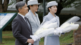Emperor Naruhito, Empress Masako and their daughter, Princess Aiko, offer flowers at a cenotaph for atomic bomb victims at ground zero in the Nagasaki Peace Park in Nagasaki on Friday. Image: KYODO