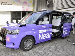 A taxi from ride hailing and sharing firm NearMe Inc. is displayed in Tokyo on Oct. 28, 2025. (Kyodo)