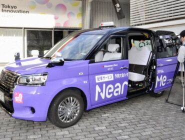 A taxi from ride hailing and sharing firm NearMe Inc. is displayed in Tokyo on Oct. 28, 2025. (Kyodo)