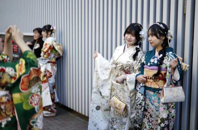 
					Kimono-clad Japanese young women take pictures after attending a Coming-of-Age Day ceremony in Yokohama, near Tokyo, Japan, 12 January 2026. EPA/FRANCK ROBICHON