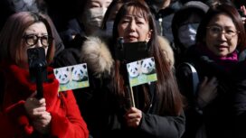Panda fans gather to see off twin pandas Xiao Xiao and Lei Lei before a truck transporting them departs from Ueno Zoo for their planned return to China, in Tokyo, Japan, January 27, 2026. REUTERS/Issei Kato