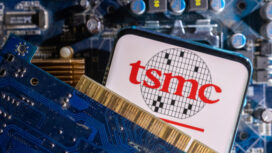 FILE PHOTO-A smartphone with a displayed TSMC (Taiwan Semiconductor Manufacturing Company) logo is placed on a computer motherboard in this illustration taken March 6, 2023. REUTERS/Dado Ruvic/Illustration/File photo