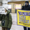 People carry messages against discrimination in Fujisawa, Kanagawa Prefecture, near Tokyo, on Jan. 29, 2026.