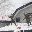 Ground Self-Defense Force personnel remove snow from a rooftop in Aomori on Monday.  Image: GSDF's 9th Division)(Kyodo