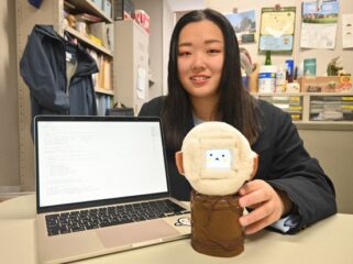 Oita University Graduate School student Miyu Fujisawa shows off the 