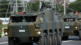 Armored vehicles of Japan Self-Defense Forces (JSDF) parade in formation at Ground Self-Defense Force Camp Asaka, November 9, 2024 in Asaka, Japan, as Japanese Prime Minister Shigeru Ishiba (not pictured) reviews troops of the country's Self-Defense Forces for its 70th Anniversary.    David Mareuil/Pool via REUTERS