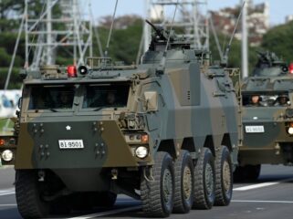 Armored vehicles of Japan Self-Defense Forces (JSDF) parade in formation at Ground Self-Defense Force Camp Asaka, November 9, 2024 in Asaka, Japan, as Japanese Prime Minister Shigeru Ishiba (not pictured) reviews troops of the country's Self-Defense Forces for its 70th Anniversary.    David Mareuil/Pool via REUTERS