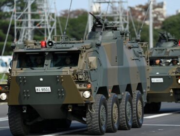 Armored vehicles of Japan Self-Defense Forces (JSDF) parade in formation at Ground Self-Defense Force Camp Asaka, November 9, 2024 in Asaka, Japan, as Japanese Prime Minister Shigeru Ishiba (not pictured) reviews troops of the country's Self-Defense Forces for its 70th Anniversary.    David Mareuil/Pool via REUTERS