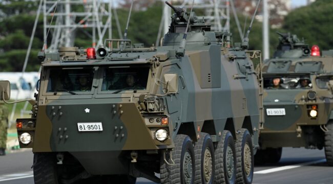 Armored vehicles of Japan Self-Defense Forces (JSDF) parade in formation at Ground Self-Defense Force Camp Asaka, November 9, 2024 in Asaka, Japan, as Japanese Prime Minister Shigeru Ishiba (not pictured) reviews troops of the country's Self-Defense Forces for its 70th Anniversary.    David Mareuil/Pool via REUTERS