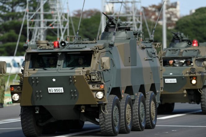 
					Armored vehicles of Japan Self-Defense Forces (JSDF) parade in formation at Ground Self-Defense Force Camp Asaka, November 9, 2024 in Asaka, Japan, as Japanese Prime Minister Shigeru Ishiba (not pictured) reviews troops of the country's Self-Defense Forces for its 70th Anniversary.    David Mareuil/Pool via REUTERS