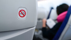 no smoking sign on plane seat.