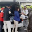 Staff members of the Vietnamese association in Kumamoto deliver relief supplies to foreign residents in the city of Yatsushiro, Kumamoto Prefecture, on Aug. 6. | JIJI @japantimes