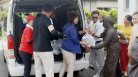 Staff members of the Vietnamese association in Kumamoto deliver relief supplies to foreign residents in the city of Yatsushiro, Kumamoto Prefecture, on Aug. 6. | JIJI @japantimes