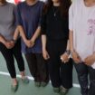 Photo taken on July 30 shows Indonesian technical interns including Davina Putri (1st from L) who are living in an evacuation shelter in Hikawa in Kumamoto Prefecture with their faces not pictured at their request.  Image: Kyodo