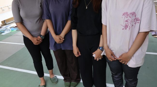 Photo taken on July 30 shows Indonesian technical interns including Davina Putri (1st from L) who are living in an evacuation shelter in Hikawa in Kumamoto Prefecture with their faces not pictured at their request.  Image: Kyodo