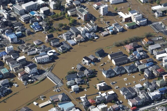 
					Photo shows a flooded residential area in Sakura in Chiba Prefecture on Tuesday.  Image: Kyodo
